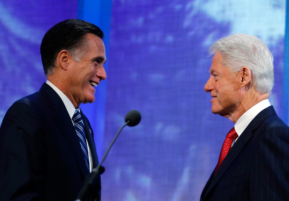 Former President Bill Clinton, right, introduces Republican presidential candidate and former Massachusetts Gov. Mitt Romney at the Clinton Global Initiative in New York on September 25.