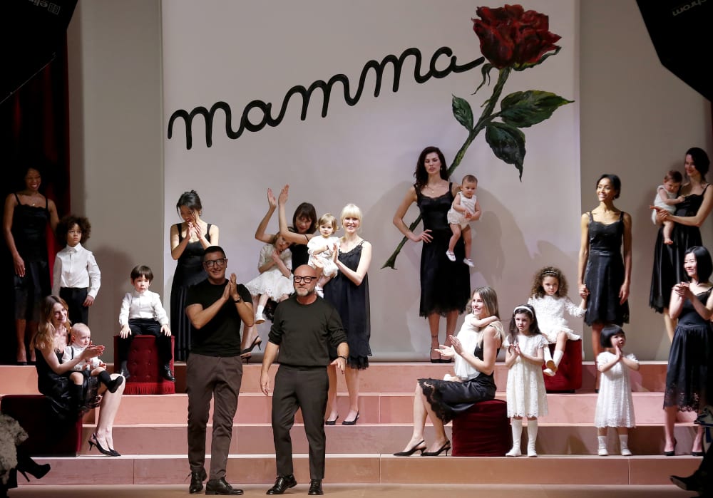 Italian designers Domenico Dolce and Stefano Gabbana acknowledge the audience at the end of their Autumn/Winter 2015/16 collection during Milan Fashion Week March 1, 2015. (Photo by Alessandro Bianchi/Reuters)