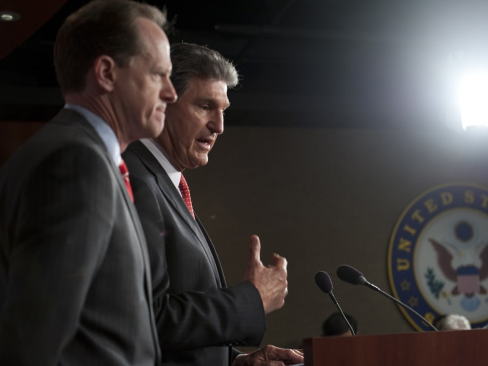 Sen. Pat Toomey, R-Pa., and Sen. Joe Manchin, D-W.V., speak at a press conference about their bi-partisan agreement to propose legislation to strengthen background checks to prevent criminals and those with mental illness from buying guns on April 10,...