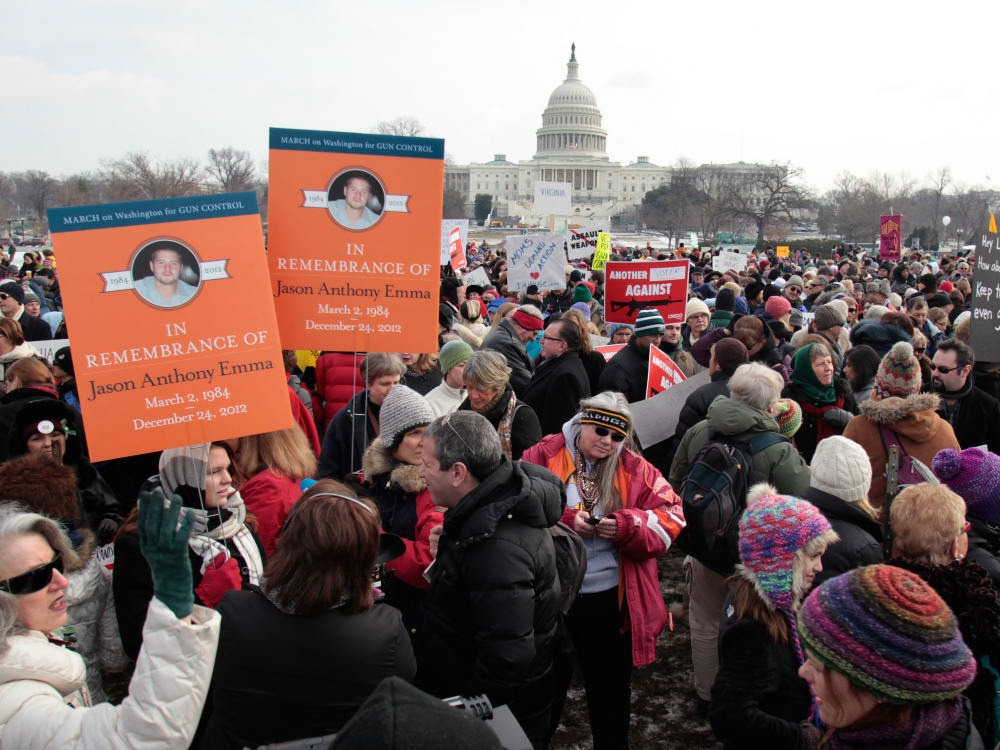 Thousands of people participate in the March on Washington for Gun Control on January 26, 2013 in Washington, following last month's school shooting in Newtown, Connecticut. (Photo by Yuri Gripas/AFP/Getty Images)