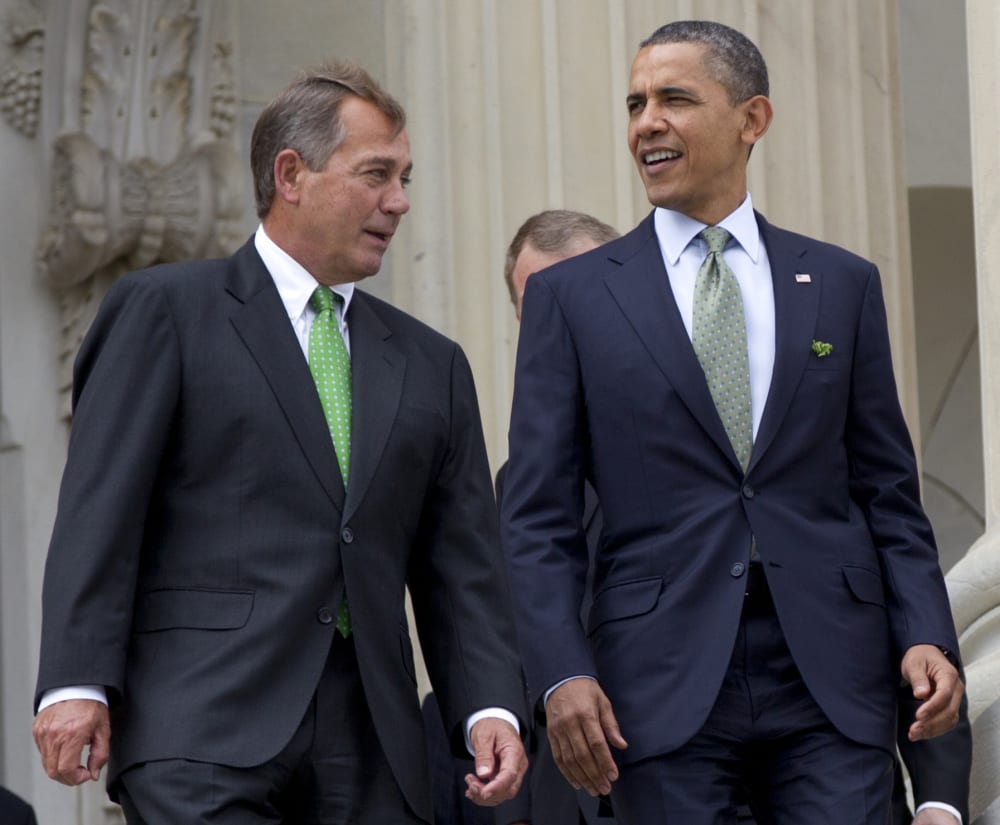 FILE - This March 20, 2012 file photo shows House Speaker John Boehner of Ohio and President Barack Obama walk down the steps of the Capitol in Washington. The people of an intensely divided nation just created a government that looks the same way as...