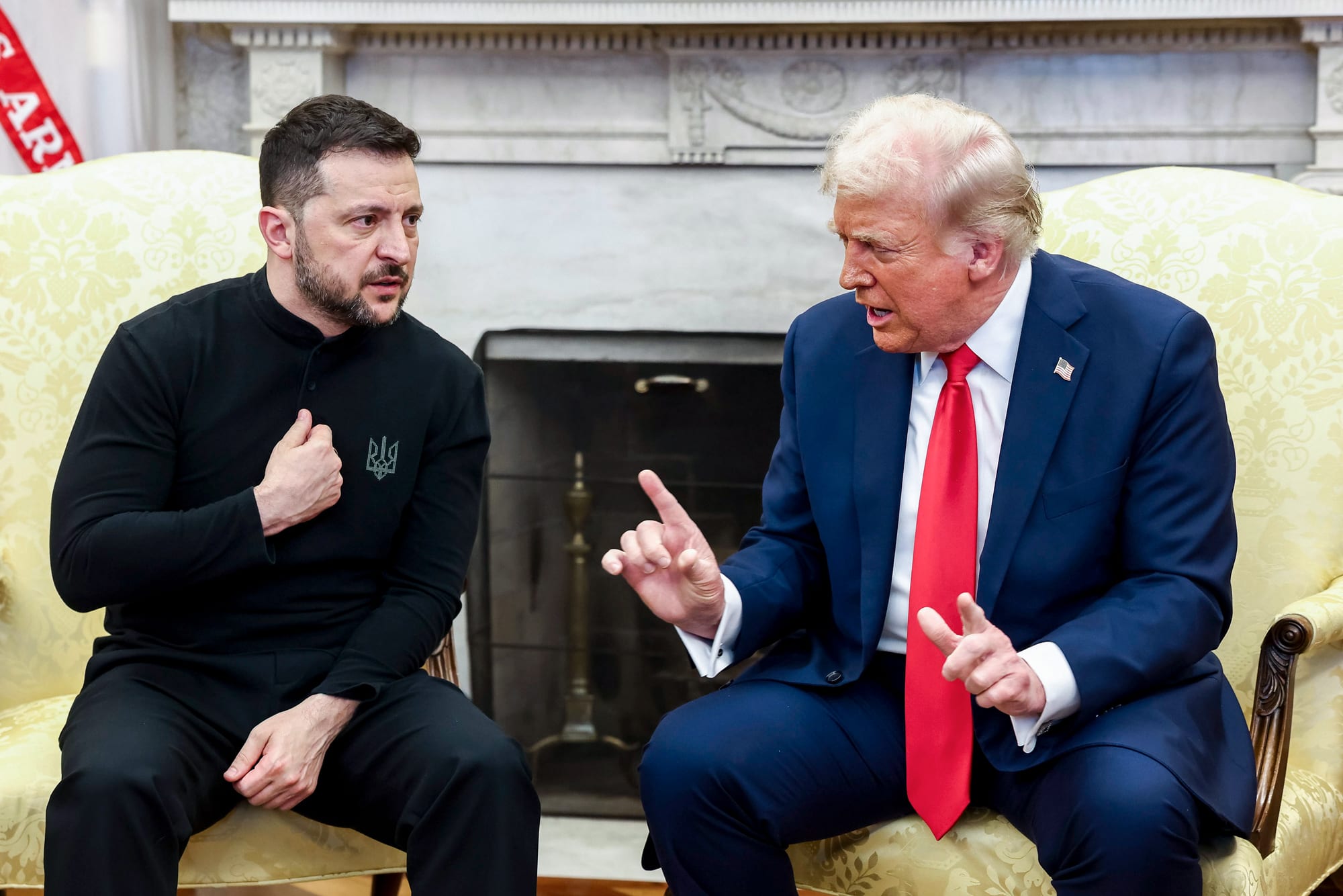 Volodymyr Zelenskyy, left, and Donald Trump talk to each other while seated