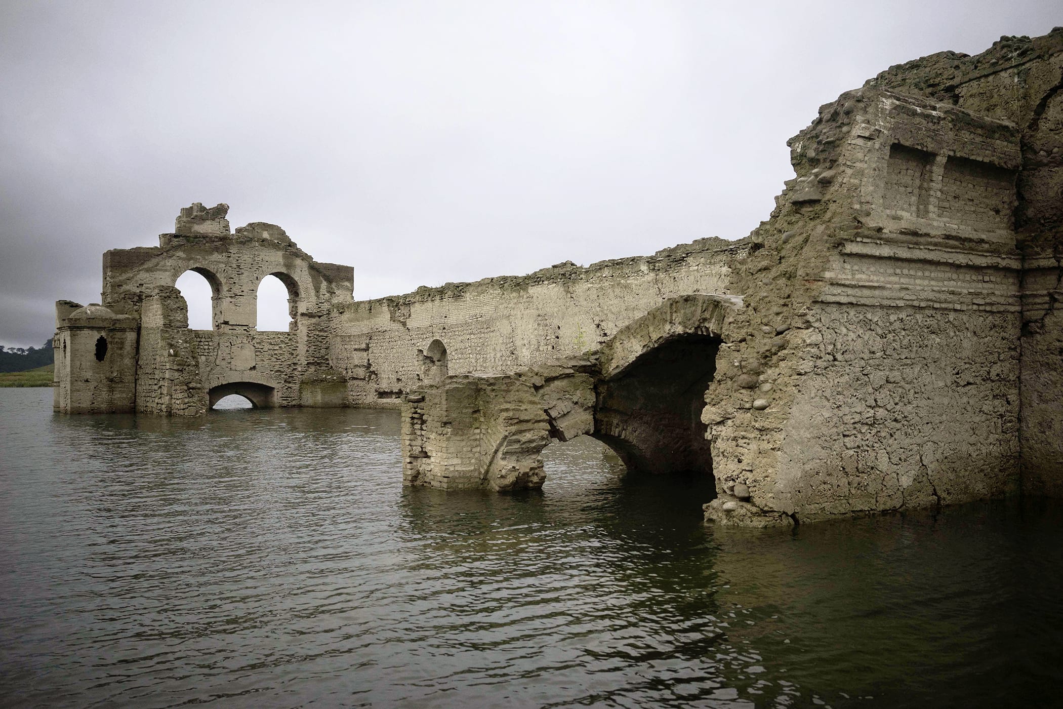 The remains of a mid-16th century church known as the Temple of Santiago, visible from the surface of the Grijalva River due to the lack of rain near the town of Nueva Quechula, in Chiapas state, Mexico, Oct. 16, 2015. (Photo by David von Blohn/AP)