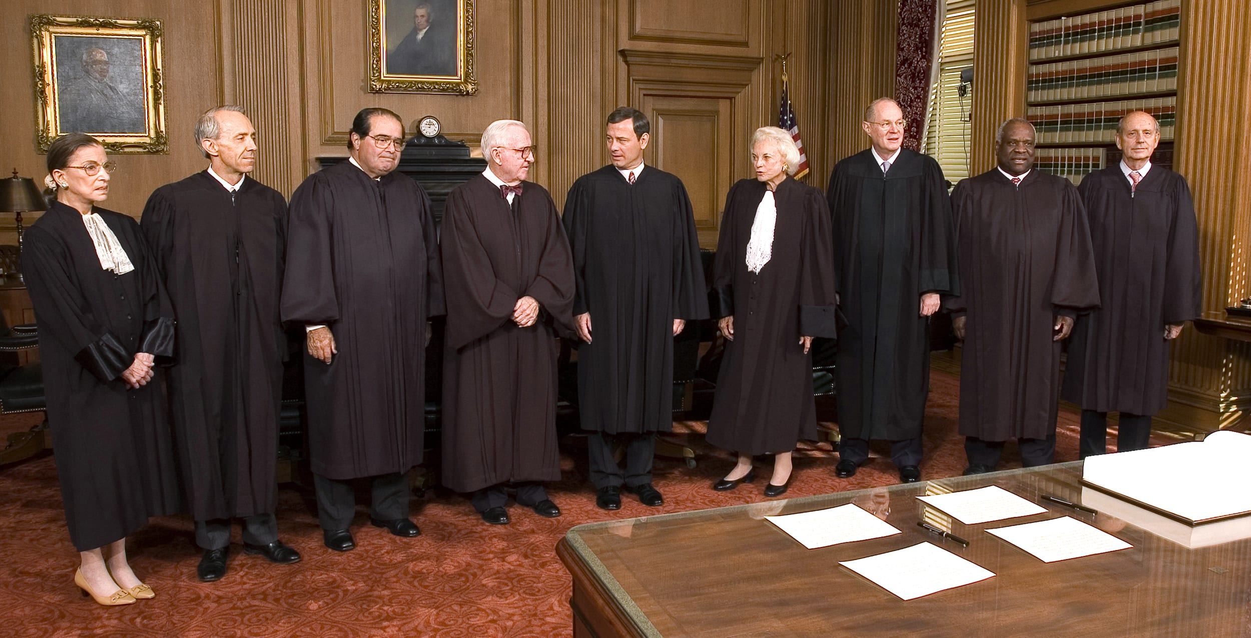 Image: Supreme Court Justices in black robes pose for a picture inside the Cheif Justice Conference Room.