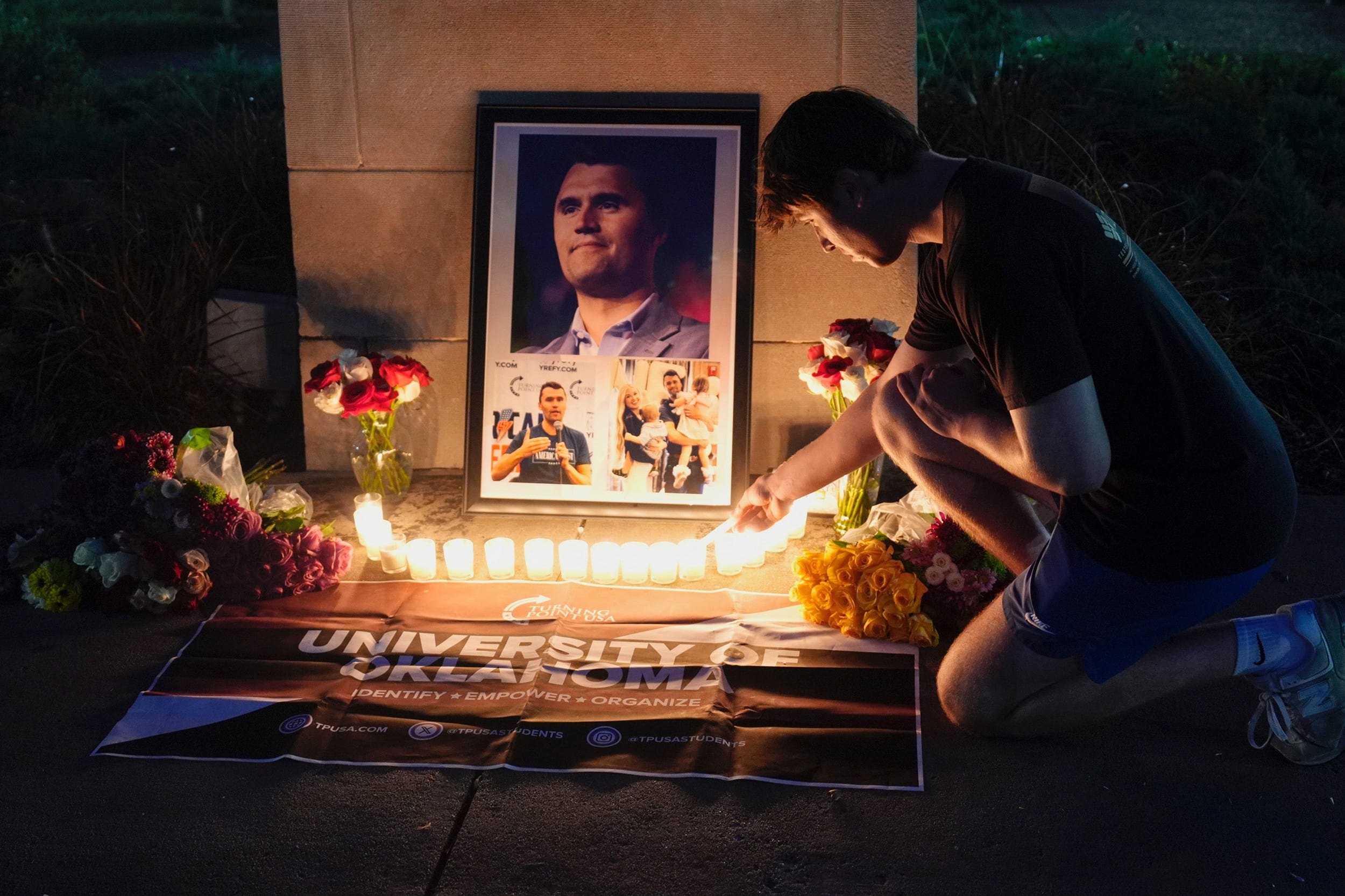 Kalib Magana lights a candle