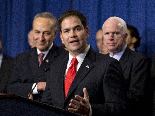 Sen. Marco Rubio, R-Fla., flanked by Sen. Charles Schumer, D-N.Y., left, and Sen. John McCain, R-Ariz., right, speaks about immigration reform legislation as outlined by the Senate's bipartisan "Gang of Eight" April 18, 2013, on Capitol Hill in...