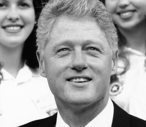 In this file photo, President Bill Clinton stands outside the North Portico of the White House with the Girls Nation group in 1996 in Washington, D.C. (Photo by David Hume Kennerly/Getty Images)