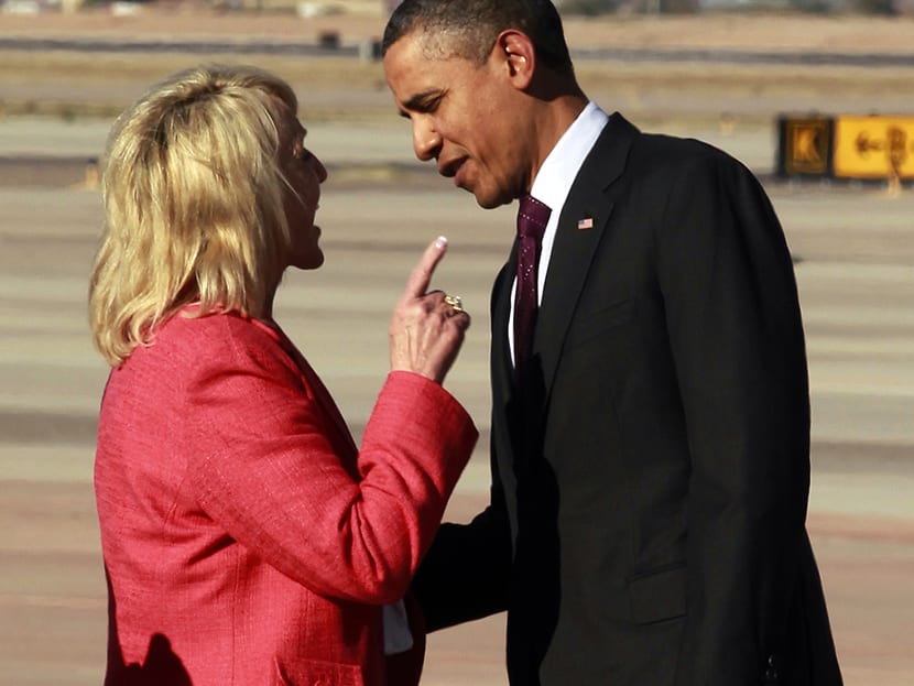 Arizona Gov. Jan Brewer points during an intense conversation with President Barack Obama after he arrived at Phoenix-Mesa Gateway Airport in Mesa, Arizona, Jan. 25, 2012. (Photo by Haraz N. Ghanbari/AP)