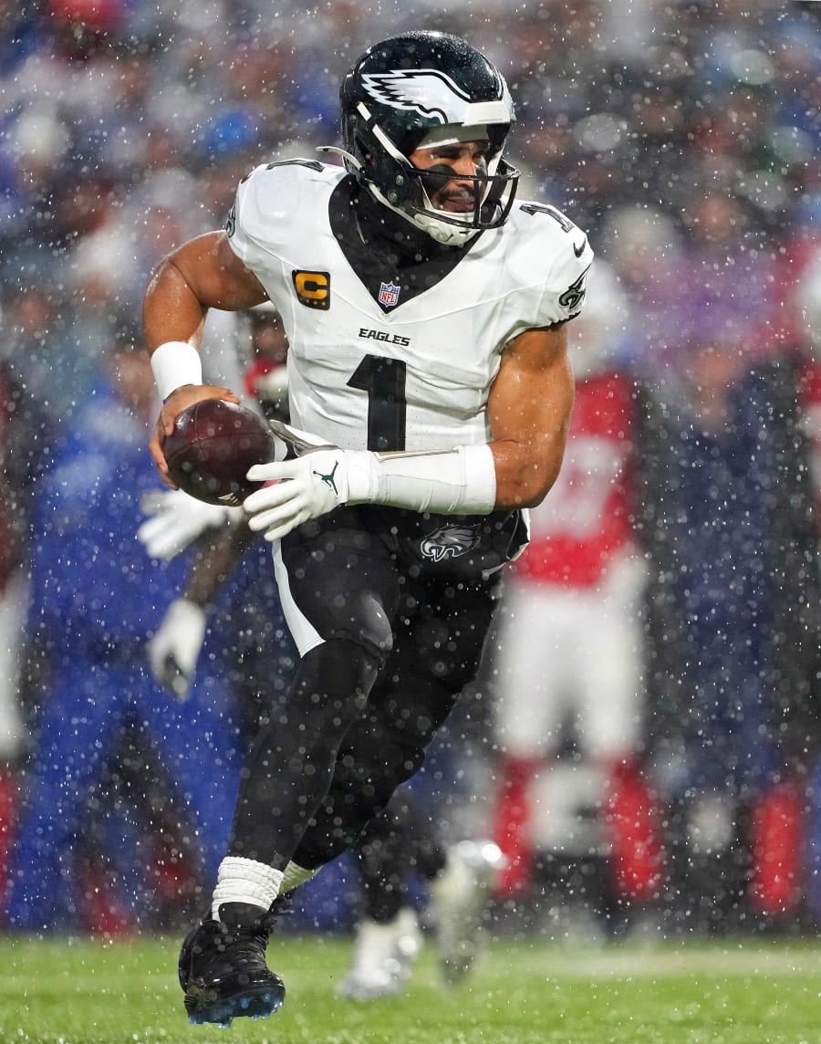 Jalen Hurts of the Philadelphia Eagles runs for yardage during the team’s game against the Buffalo Bills. The Eagles won, 13-12, after Bills quarterback Josh Allen missed an open receiver at game’s end.