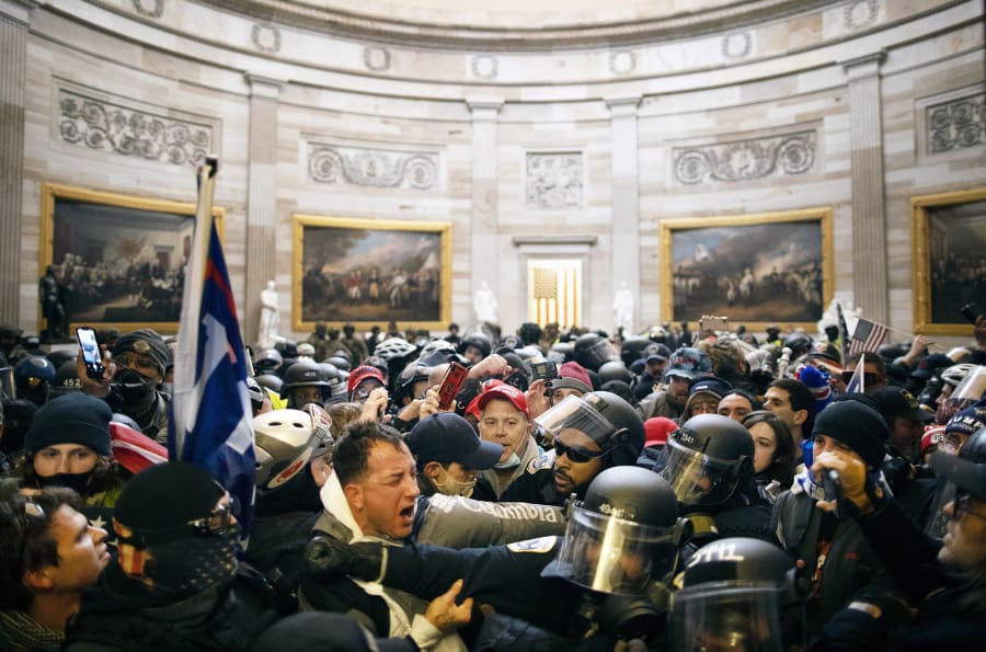 Police clash with supporters of US President Donald Trump who breached security and entered the Capitol building on Jan. 06, 2021.