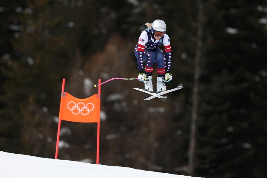 Lindsey Vonn jumps on her skis.