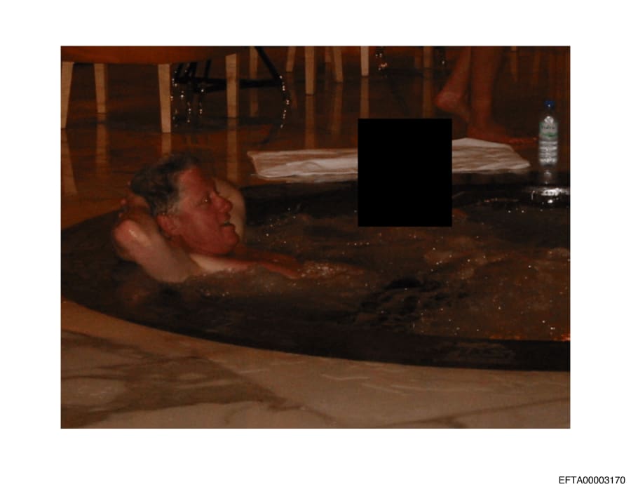 Bill Clinton in a hot tub with an unidentified person