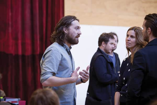 Simon Stone speaks with actors Katherine Tonkin and David Paterson during rehearsals for The Cherry Orchard.