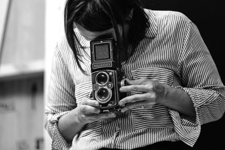 Artwork for The woman behind the lens