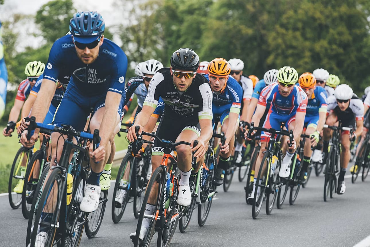 Group of cyclist on asphalt road
