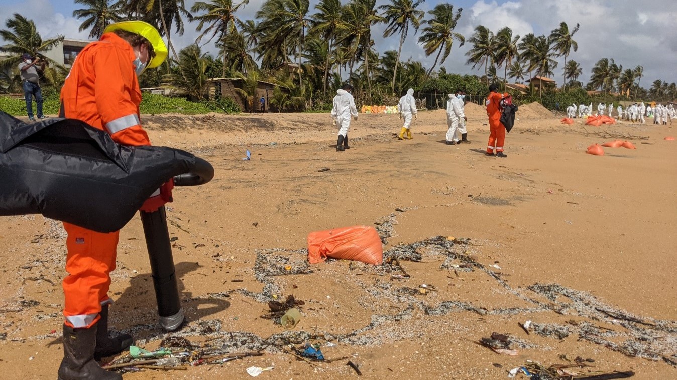 Oil spill response teams deploy a blower vacuum technique to efficiently remove plastic nurdles from contaminated shorelines. This method is part of the targeted cleanup efforts following the X-Press Pearl disaster.