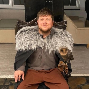 Ben posing with a Barn Owl while in ful Game of Thrones costume
