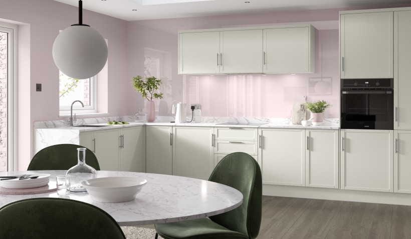 Hero shot of the Shaker Slim Kitchen in Cream with open shelving, stools and bar handles