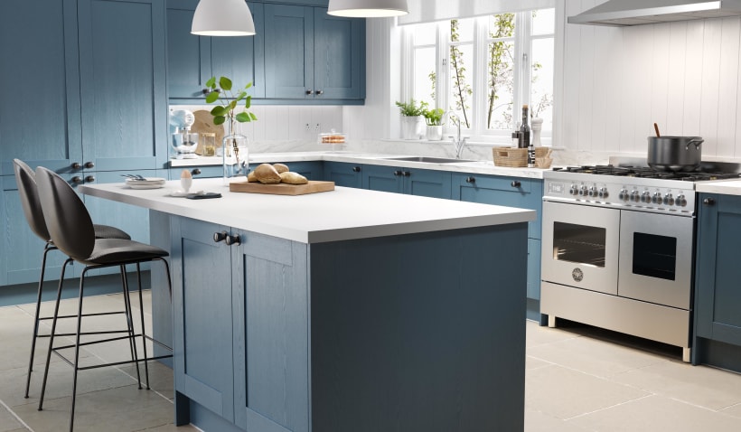 Hero shot of the Shaker 5 Piece Kitchen in Indigo Blue featuring kitchen island and stools as well as gas cooker