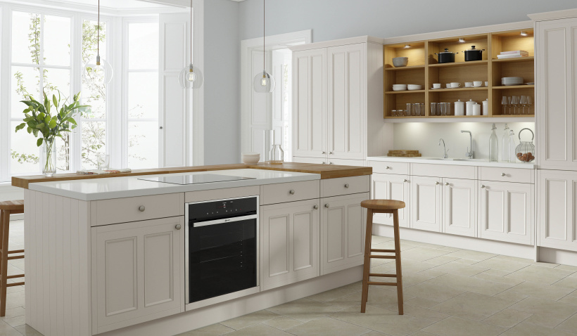 Country Ermine Kitchen in Pebble Grey Matt featuring kitchen island with a built-in oven, stools and open shelving