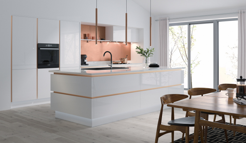 Hero shot of the Milano Ultra Kitchen in Bianco featuring pendent lighting and gold profiles.