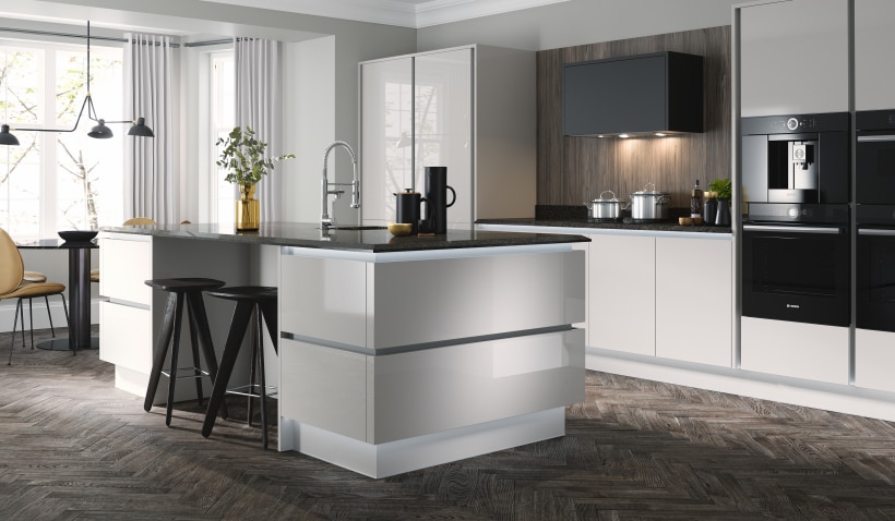 Hero shot of the Milano Ultra Kitchen in Bianco featuring TV unit and stools