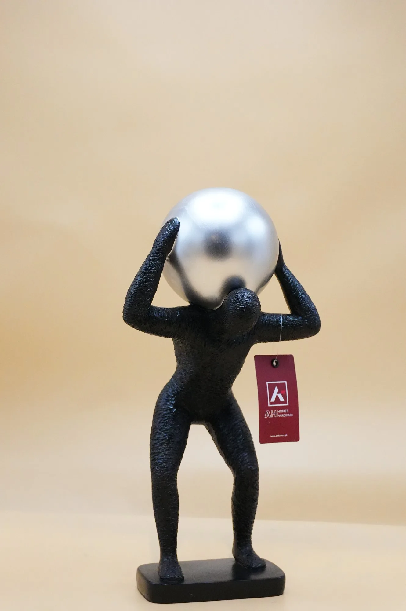 Abstract Human Sculpture with Silver Sphere