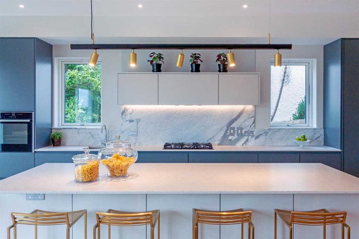 photo of rail lighting in small apartment kitchen