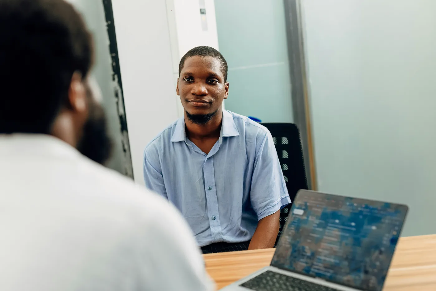 An employer meeting with a team member