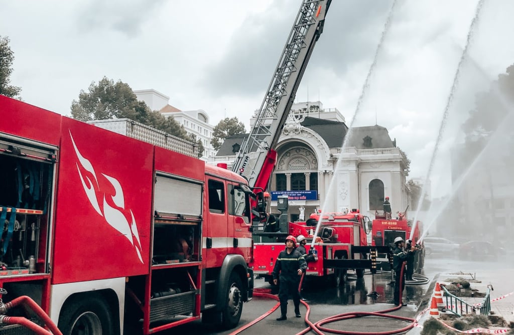 Aerial trucks in operation in a commercial area.