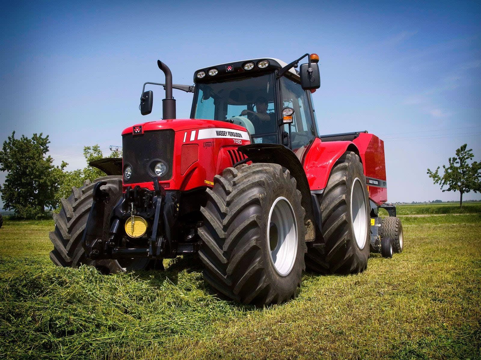 Massey Ferguson 7480 in a grass field.