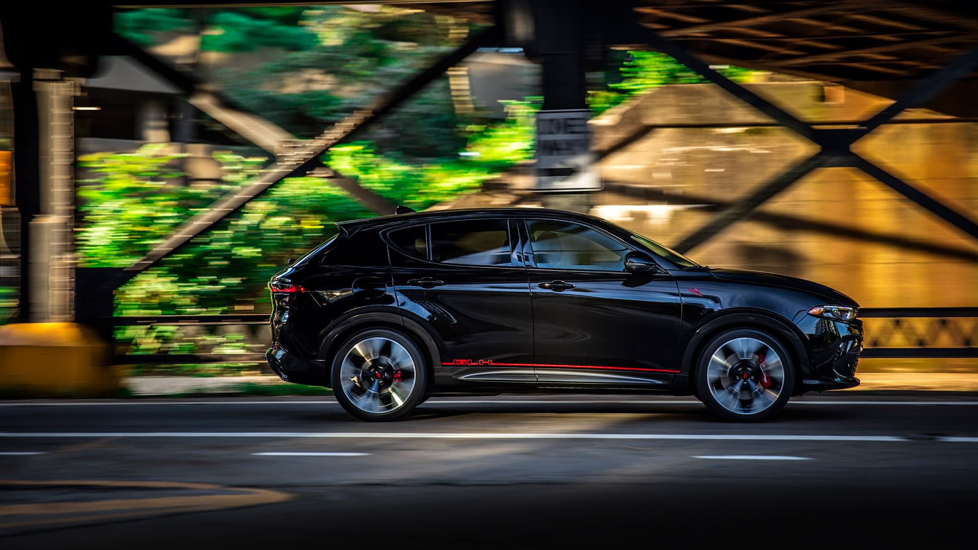 Dodge Hornet, one of the many electric vehicles (hybrid) available, driving in the city.