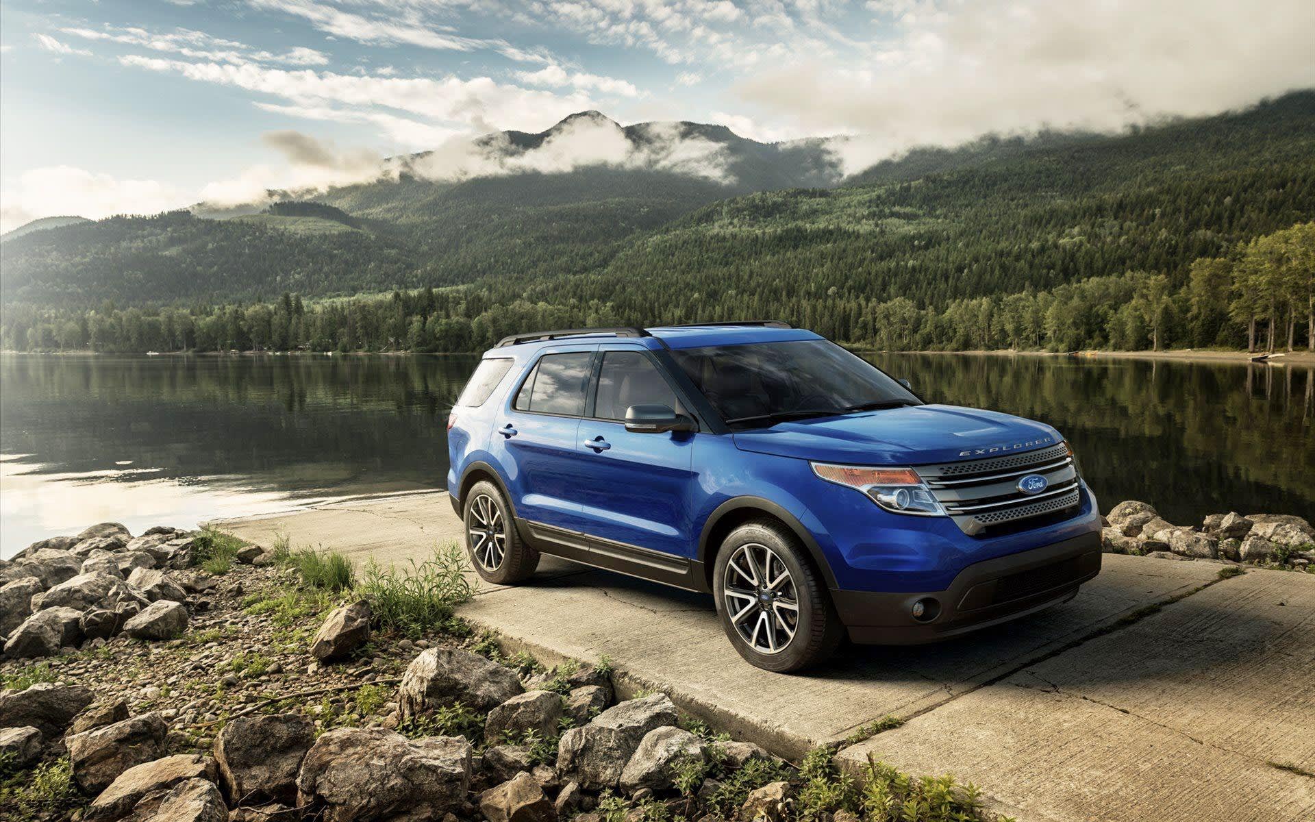 Dark Blue Ford Explorer with mid-range reliability ratings compared to others in its class and extra space for cargo.