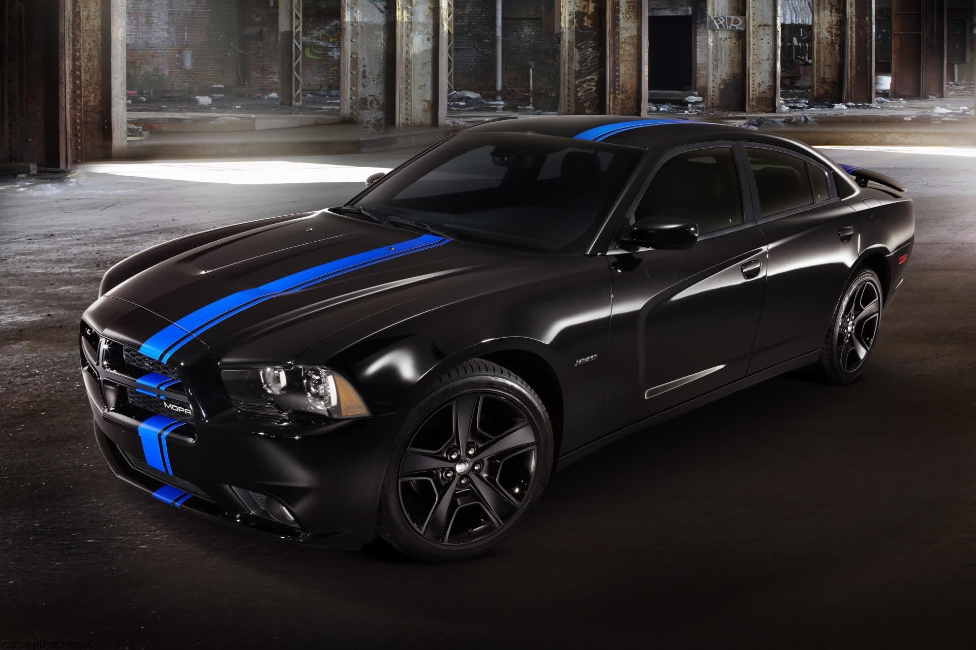 2011 black modern Charger under a bridge.