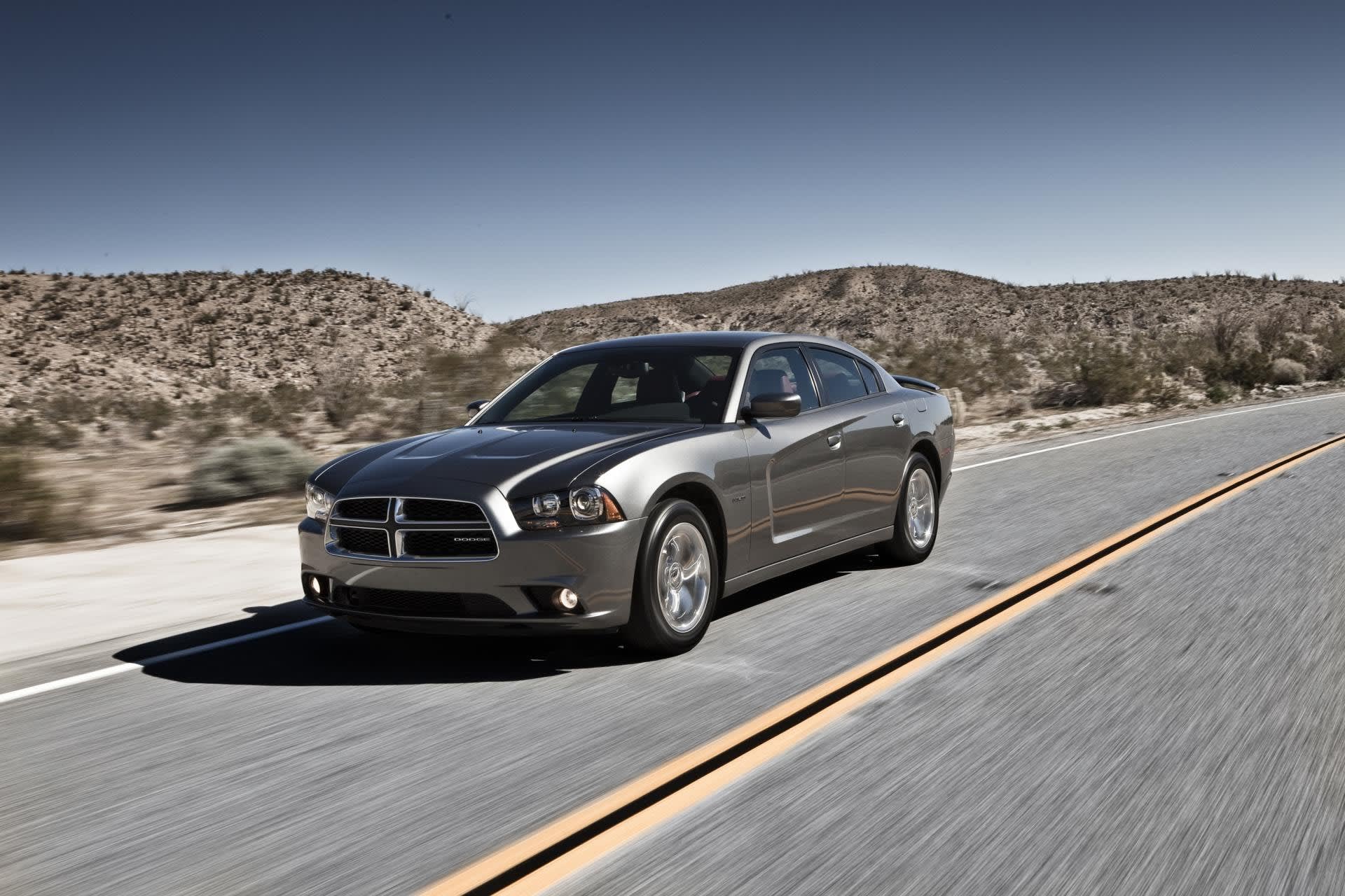 Silver Dodge Charger car driving on the highway.