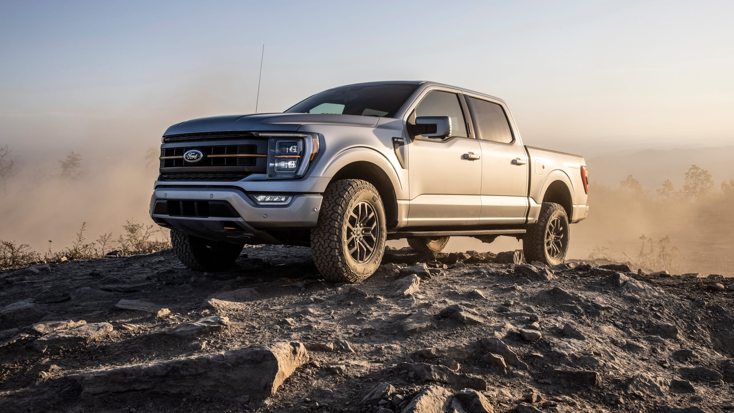 2021 Ford F-150 with rear and front seats parked at the top of a rocky hill.