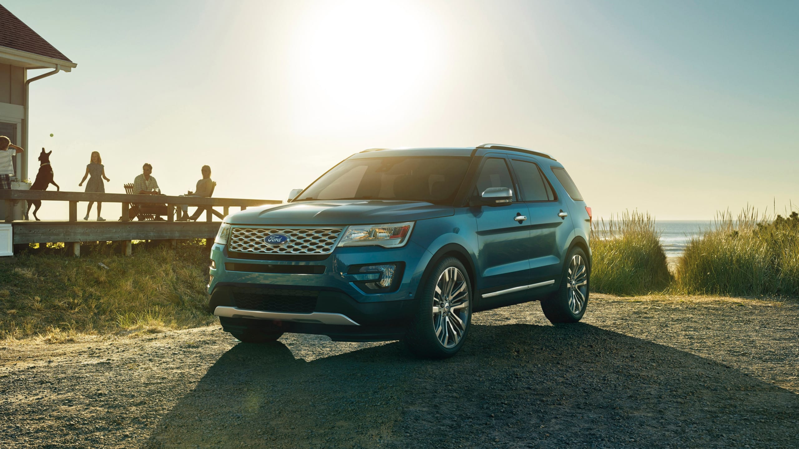 2025 Ford Explorer parked at sunset in front of the ocean, among the most reliable Ford Explorer years.