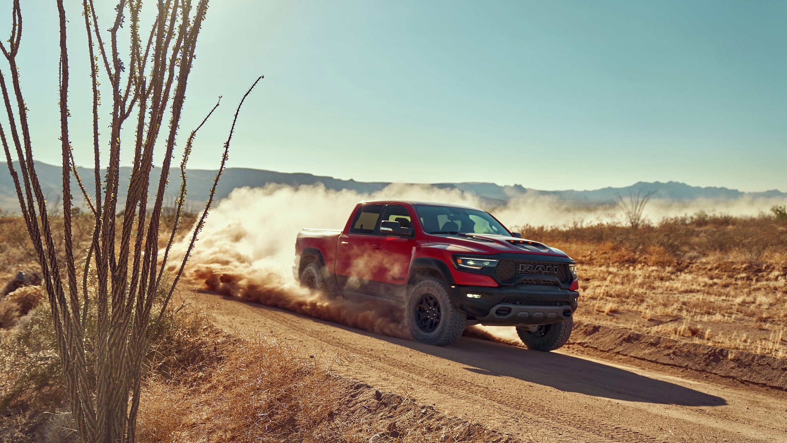 Red Ram truck, one of the most reliable on the market today, driving down a dusty road.