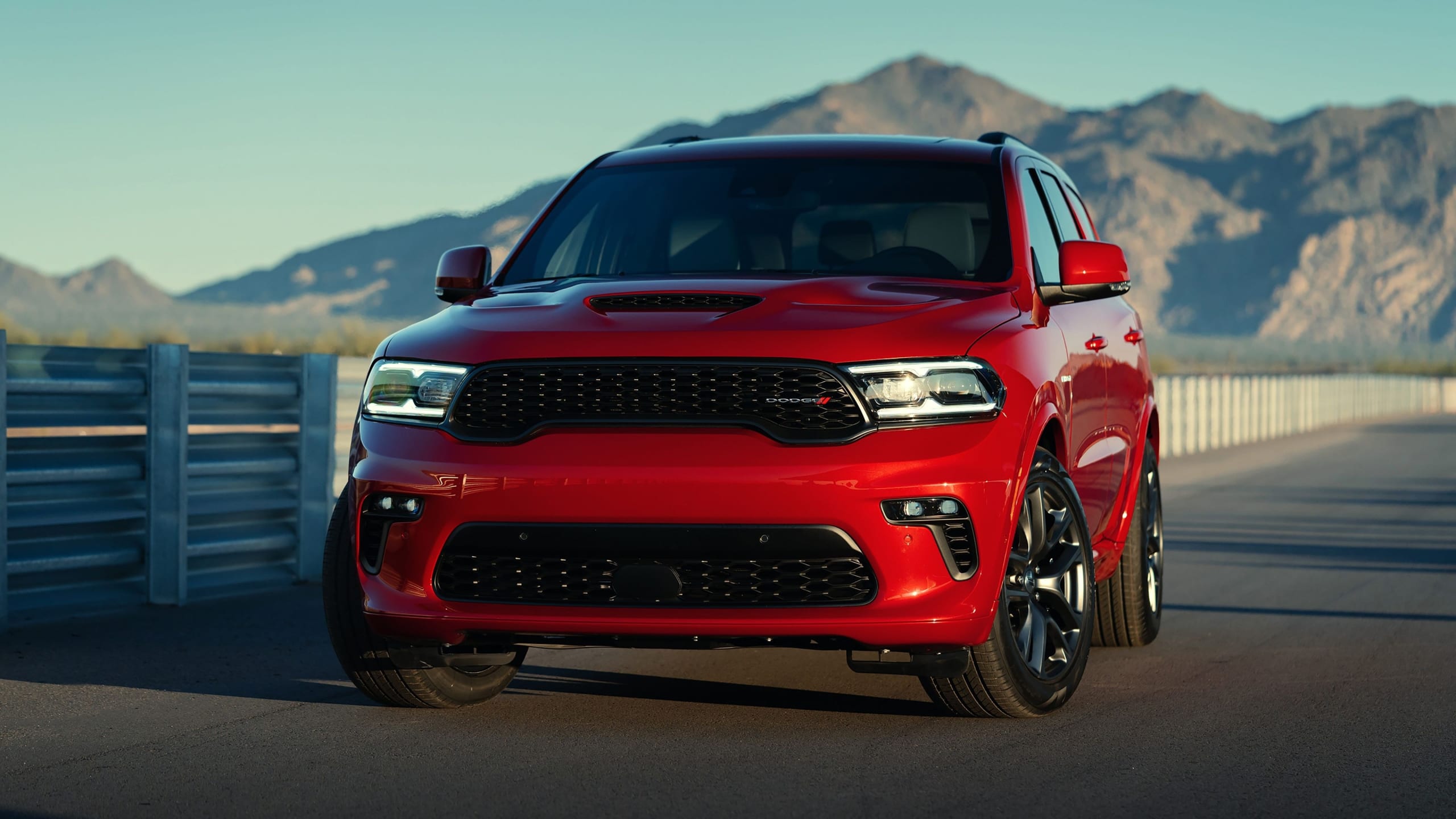2021 Dodge Durango parked at sunset among the mountains.
