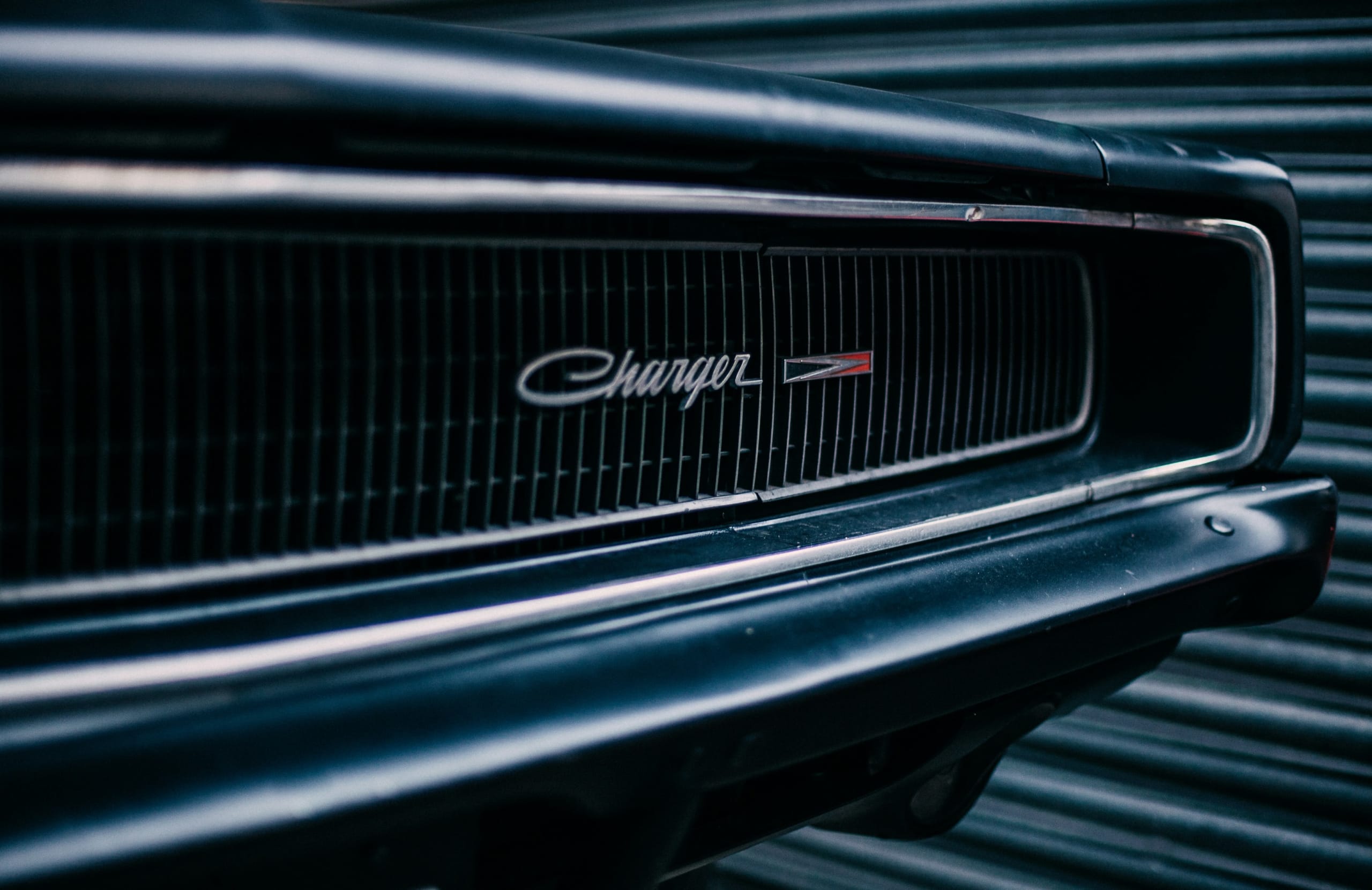 A Charger's distinctive retro grill. Photo by Clem Onojeghuo on Unsplash.