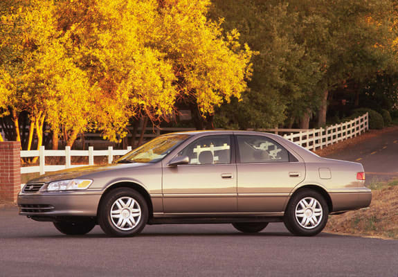 1999 Toyota Camry car (fourth generation) parked in autumn in front of trees.