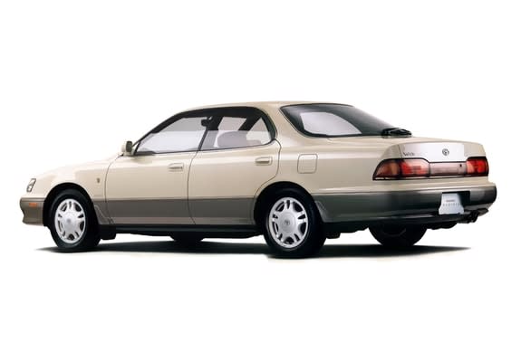 Beige 1990 Toyota Camry car on a white background.