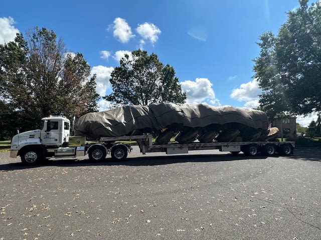 A Lingo fleet truck transporting landscaping materials to a worksite. A Lingo fleet truck transporting landscaping materials to a worksite.