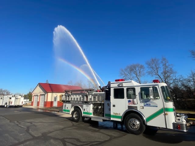 The Lingo Group in the community with a fire truck. The Lingo Group in the community with a fire truck.