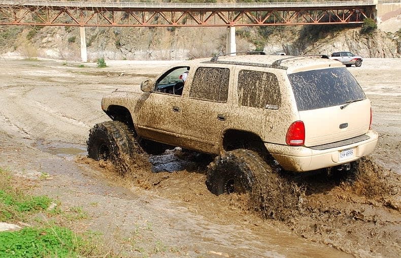 1999 Dodge Durango, one of the Dodge Durango years to avoid, with low owner satisfaction, driving in the mud.