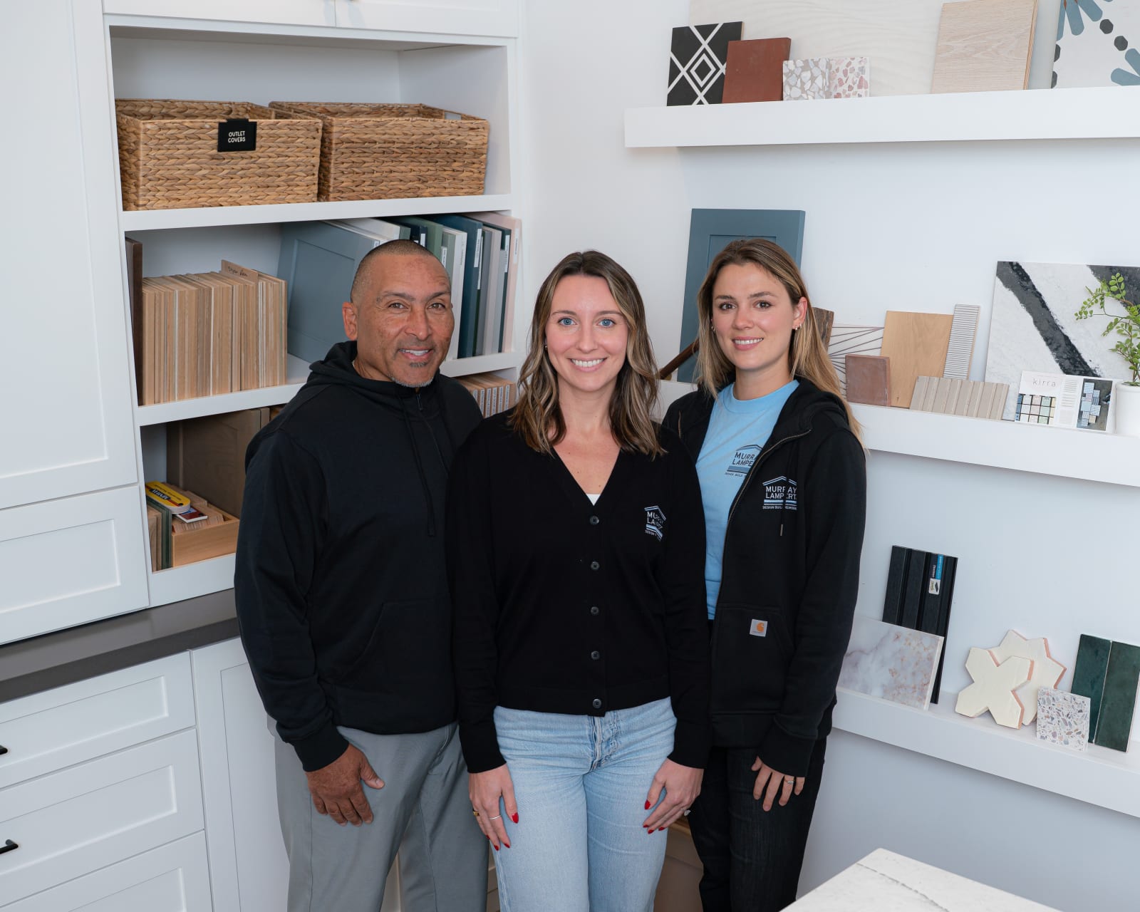 Murray Lampert in-house architectural design team reviewing remodeling plans in their San Diego studio