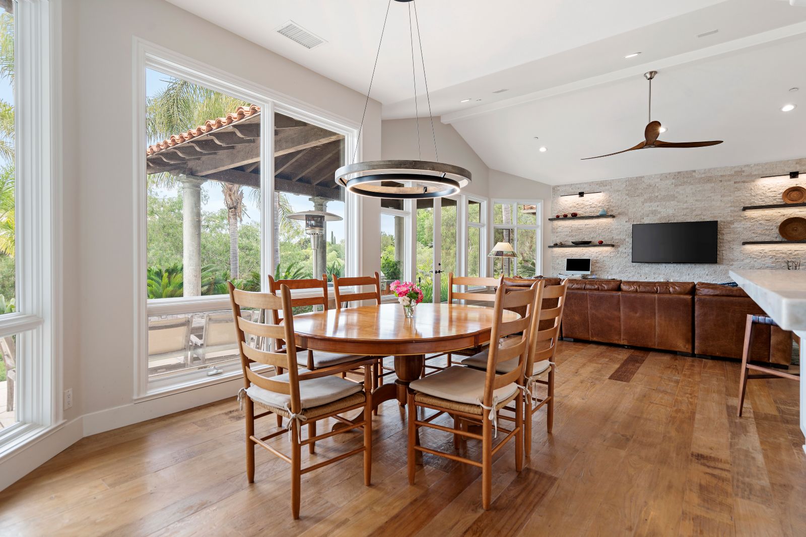 Bold wired hanging light fixtures in dining room become instant focal points