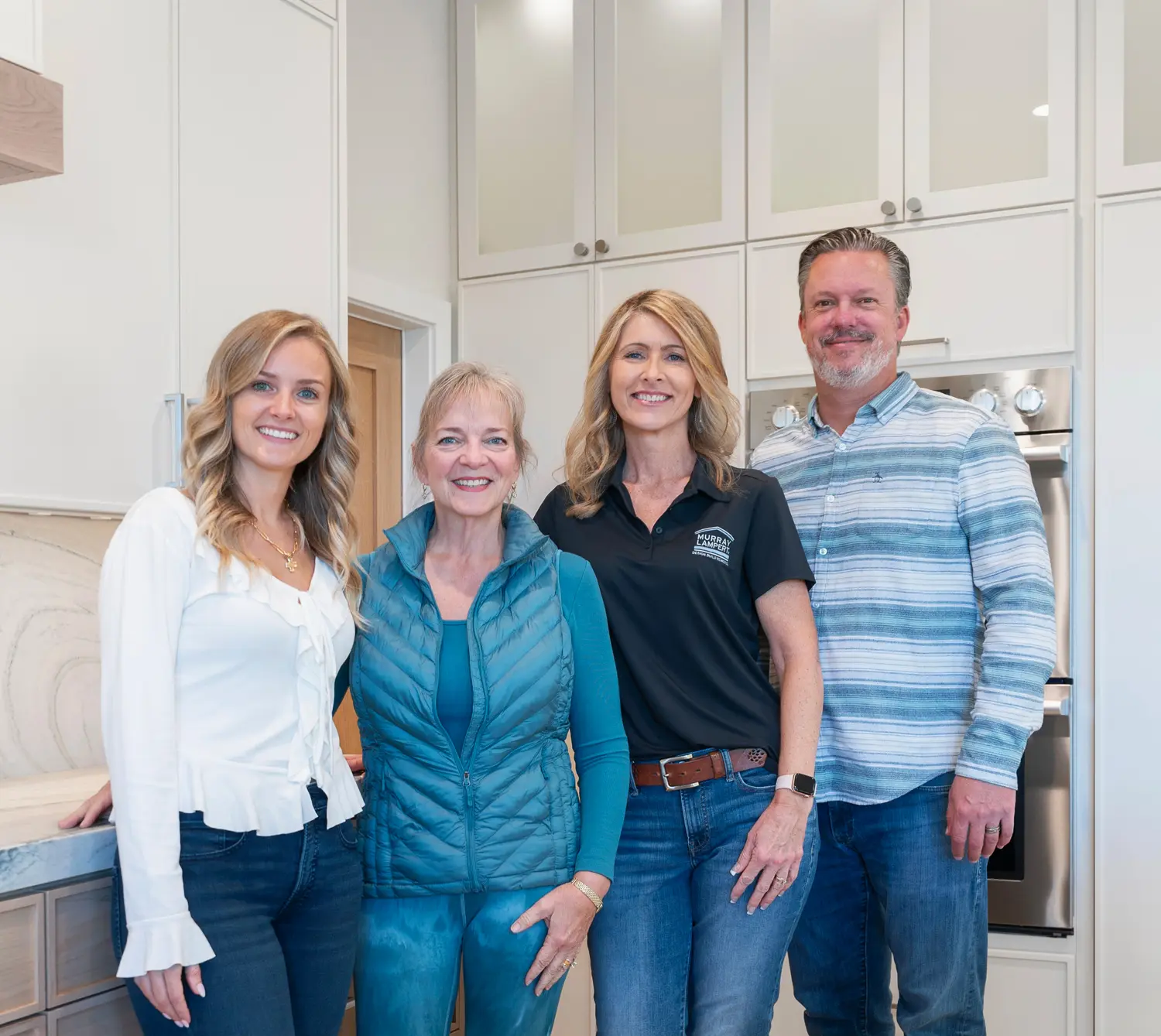 The Murray Lampert team celebrating with the homeowner in her newly remodeled Escondido kitchen
