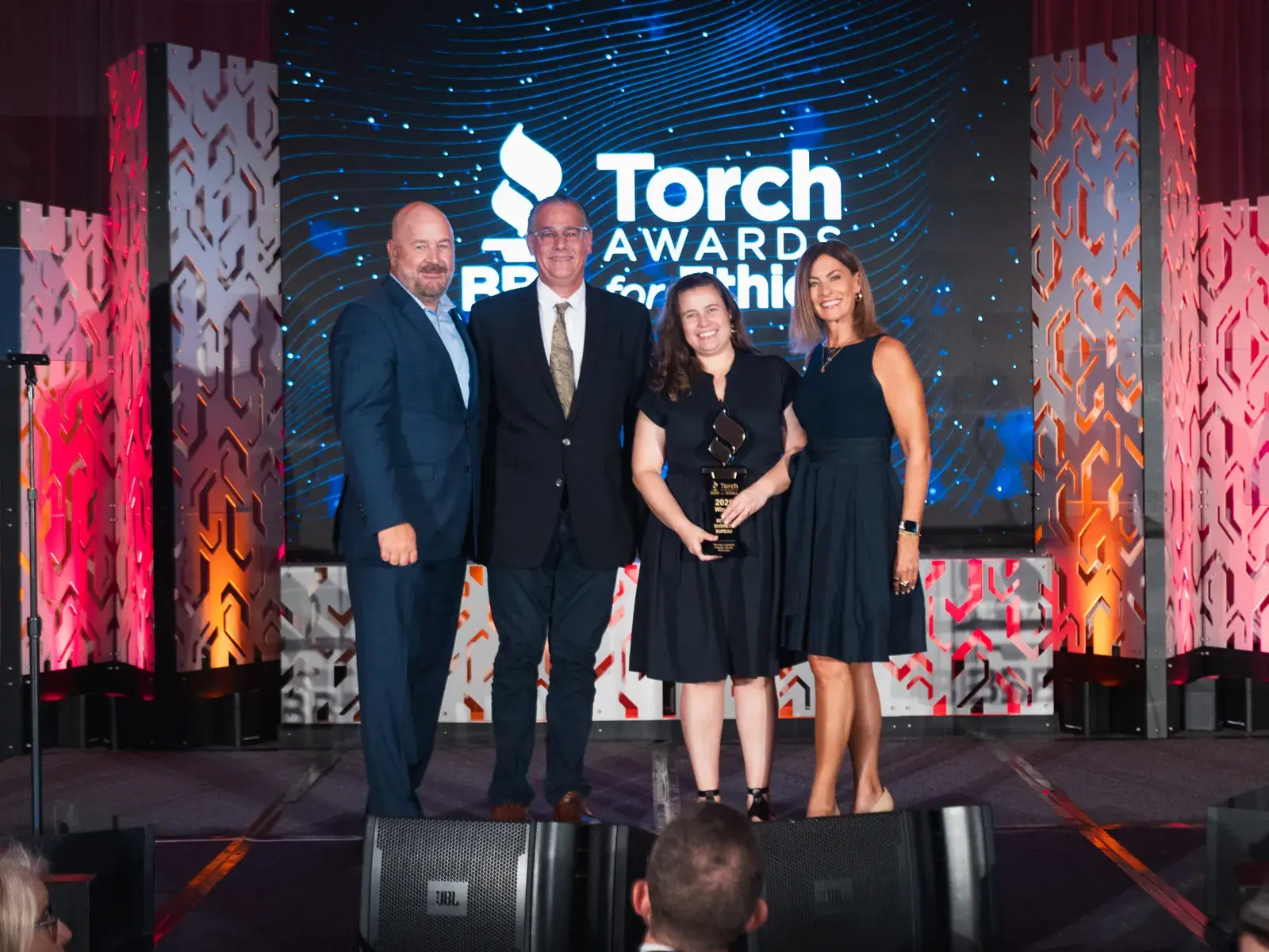 Murray Lampert accepting the 2026 BBB Torch Award for Ethics on stage at the La Jolla Marriott