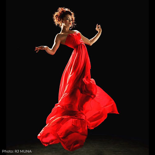 Photo by RJ Muna of performance artist Chloe Marvel Light Axelrod floating in mid air